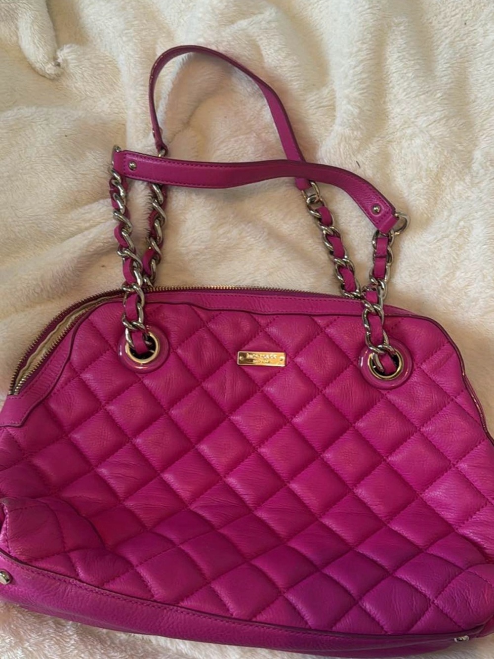 Hot pink quilted leather Kate Spade New York shoulder bag with a chain strap